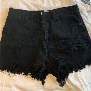 Distressed black jean shorts